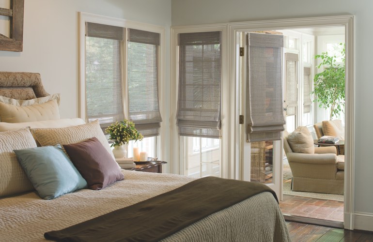 Contemporary bedroom with light woven shades